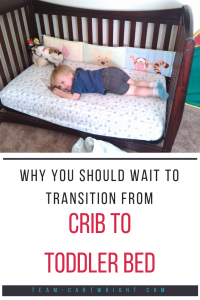 Text: Why You Should Wait to Transition from Crib to Toddler Bed Picture: boy toddler happily laying down on his toddler bed