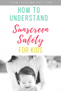 picture of a mom holding a happy bay splashing in a pool. Text overlay How To Understand Sunscreen Safety For Kids