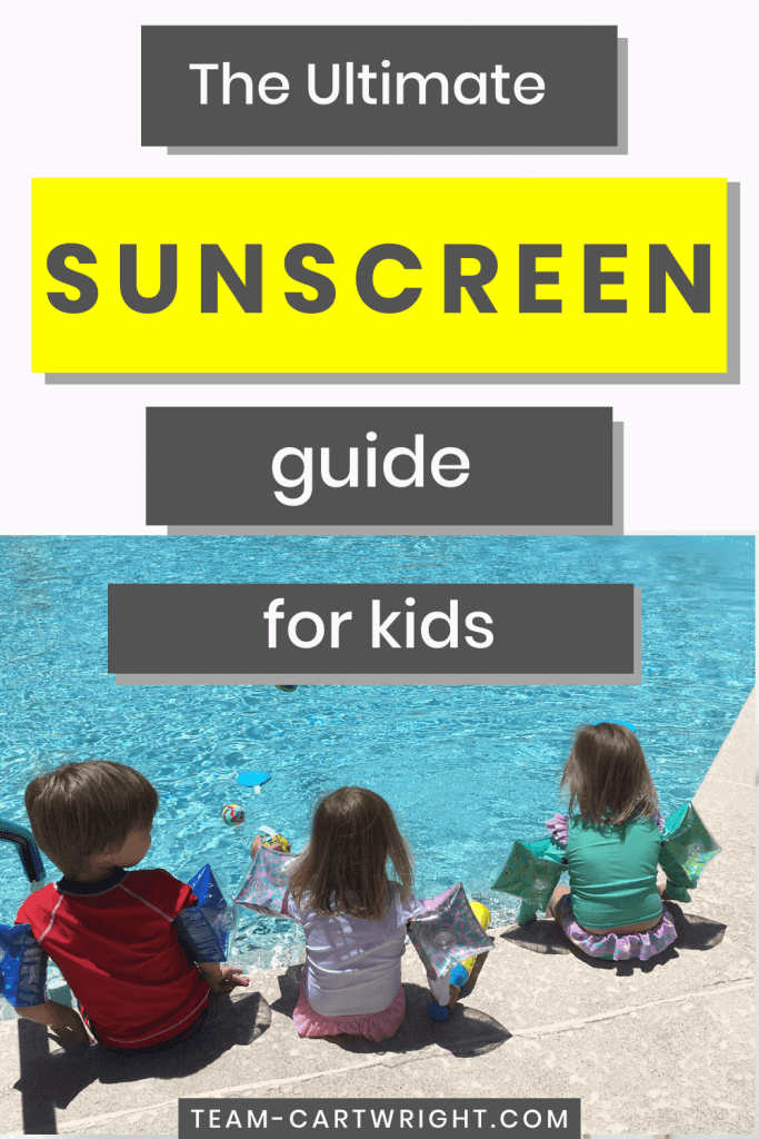 The Ultimate Sunscreen Guide for Kids with picture of 3 young children sitting facing a swimming pool