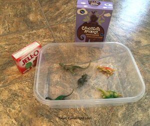 Sensory STEM fun with a tasty archaeological dig. Use Jell-O to create a science project your kids can eat! #STEMactivity #scienceathome #toddlerlearning #preschoollearning #homeschool #birthdaypartyactivity #kidcraft