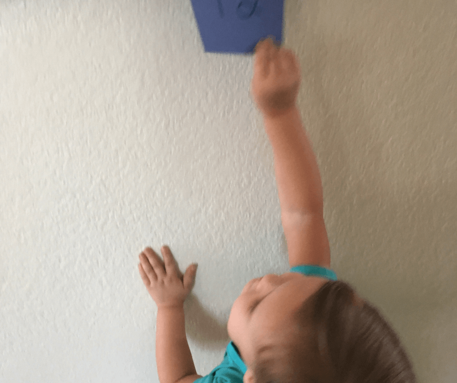 Simple number game! Tape numbers 1-12 on your wall. Then have your kids roll some dice, add up the numbers, and run to that number! Get the wiggles out and learn number sense! #learning #activity #number #sense #counting #adding #preschool #toddler #homeschool Team-Cartwright.com