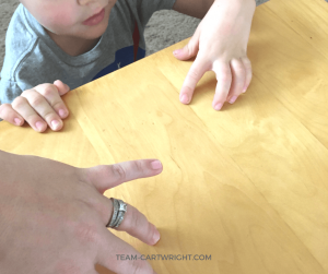 Learn why you can't life your ring finger when your other fingers are on the table. Get the explanation plus more fun and easy human body science experiments to wow your kids! Simple and fun tricks of perception. #STEM #science #learning #activity #human #body #experiment Team-Cartwright.com