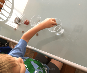 Try this simple and fun science experiment with your kids! Challenge them to clean a penny with ketchup and other kitchen condiments. Does it work? Learn the science behind this neat chemical reaction! #science #STEM #learning #activity #kids Team-Cartwright.com