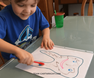 Tooth brushing activity in action! Learn how to help your child brush their teeth, plus get a free printable! #toothbrushing #brushteeth #preschool #toddler Team-Cartwright.com