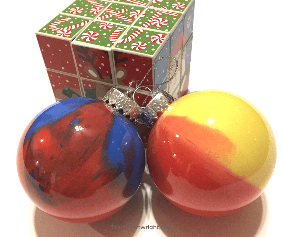 Homemade Marbled Ornaments: A Fun STEM Christmas Activity. Make some fast and fun Christmas ornaments and learn a little science! Easy, fun, and full of holiday joy. #christmasscience #christmasSTEM #science #STEM #homemadeornaments #christmascraft #learningactivity #christmaslearning #toddler #preschool #kids Team-Cartwright.com