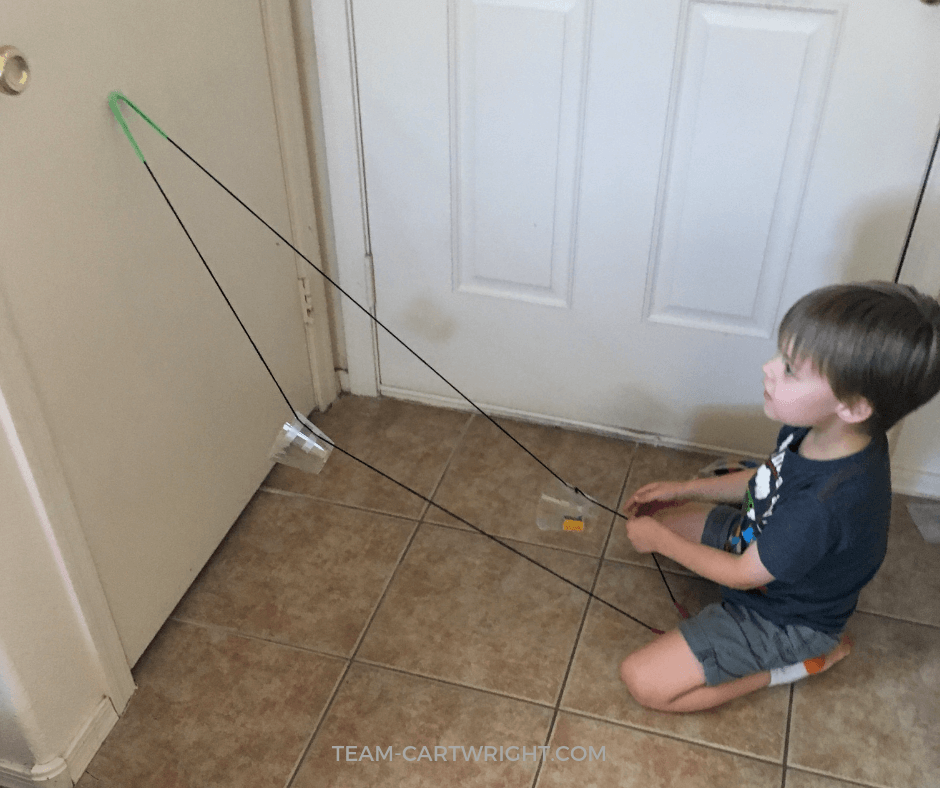 How to make a funicular train at home! (Also known as a ski lift. :) ) Learn how to utilize pulleys to create this fun lift, and teach your child some physics! #FunicularTrain #SkiLift #SimpleMachines #PulleysForKids #STEM #Physics Team-Cartwright.com