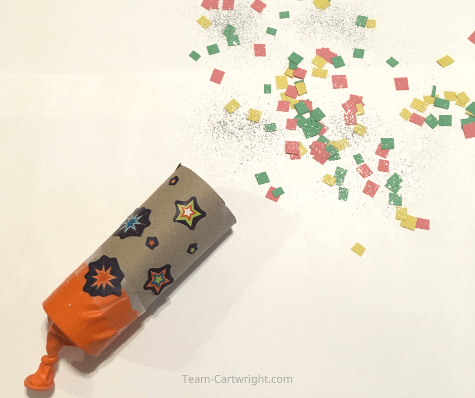 Homemade Confetti Poppers! Learn how to make this simple and fun craft for a fun celebration! It is a great creative project and a wonderful learning activity. Plus you can learn some science! #NewYearsEveCraft #DIYConfettiPopper #HomemadeConfettiPopper #GenderRevealConfettiPopper #LearningActivity #ToddlerLearning #PreschoolLearning #BirthdayParty Team-Cartwright.com