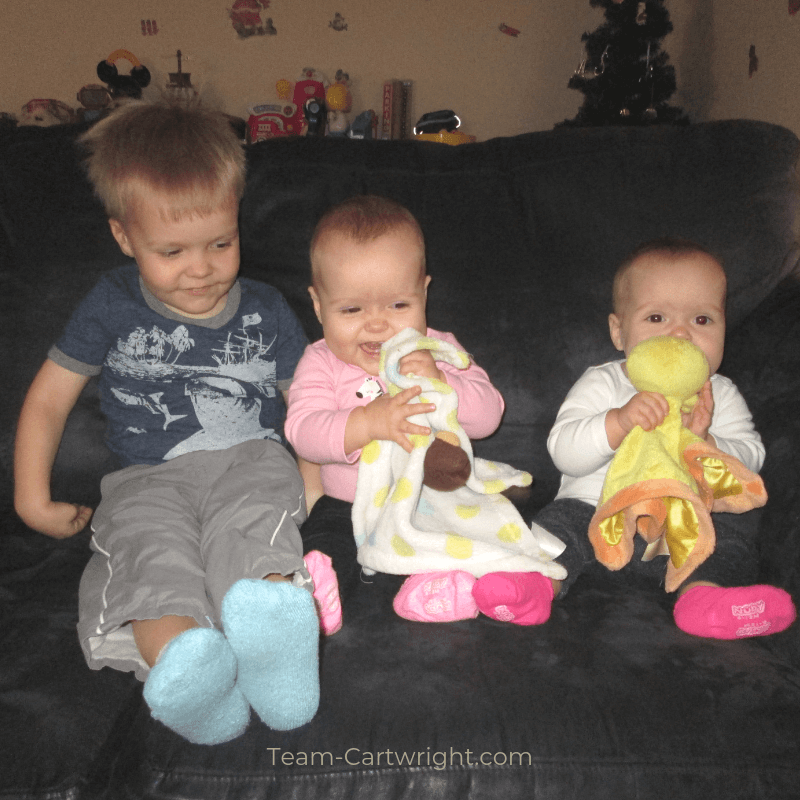picture of a toddler and twin babies