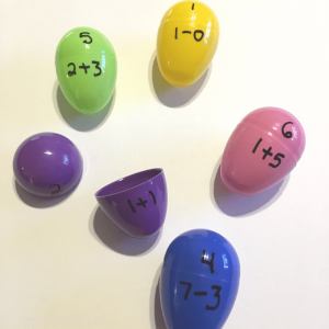 picture of colorful easter eggs with math equations written on them.