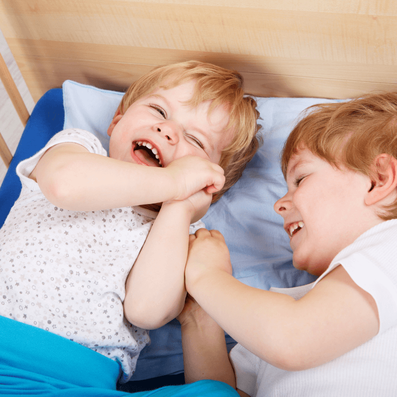 picture of twin boys giggling