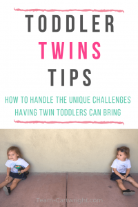 picture of twins sitting against a wall with text overlay: Toddler Twins Tips How to handle the unique challenges having twin toddlers can bring
