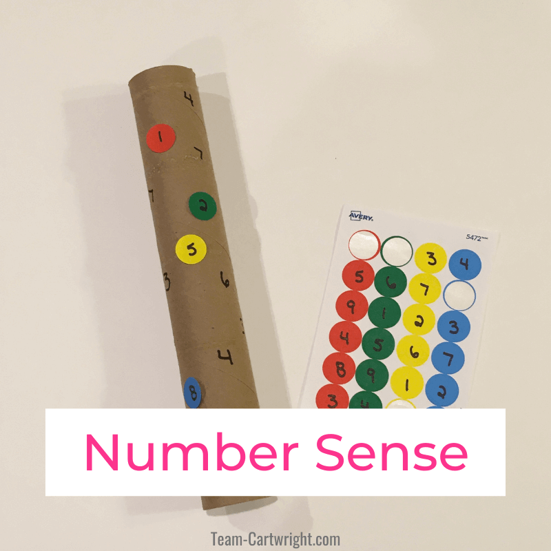 Links to: number sense activities  Text: Number Sense  Picture: Paper Towel Roll number game with numbers written on roll and sheet of round stickers with numbers to match