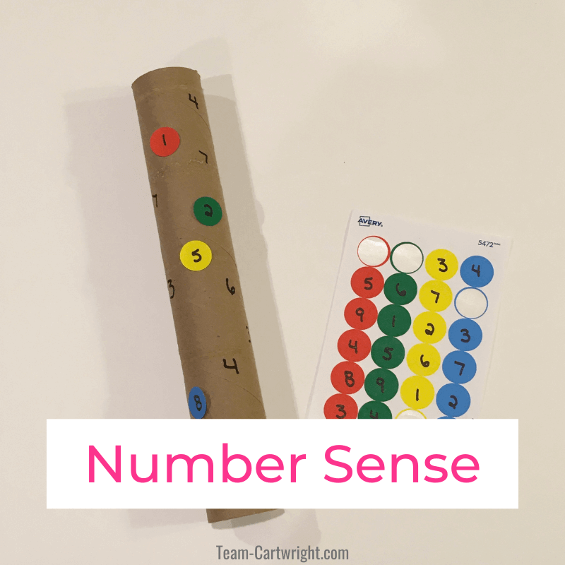 Links to: number sense activities Text: Number Sense Picture: Paper Towel Roll number game with numbers written on roll and sheet of round stickers with numbers to match