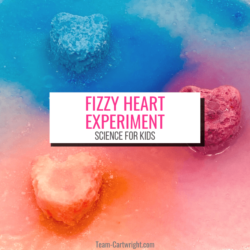 Text: Fizzy Heart Science Experiment, science for kids. Picture: 3 hearts, blue, purple, and red, fizzing and surrounded by the same color liquid