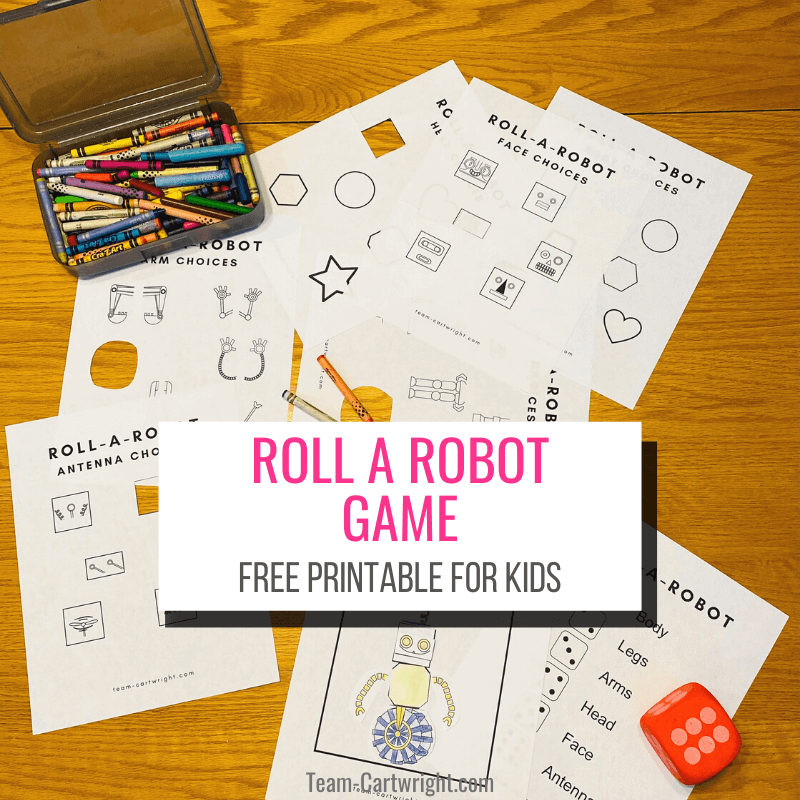 Text: Roll A Robot Game Free Printable for Kids  Picture: Roll a Robot printables on a table with crayons, red dice, scissors, glue, and robot put together through playing game
